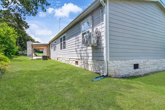 a view of a house with a big yard
