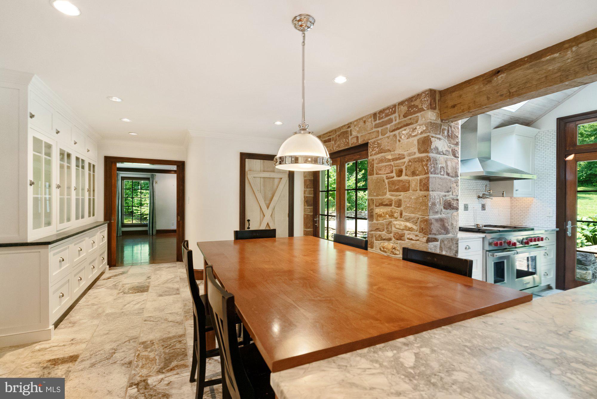 5750 Lower Mountain Road New Hope, PA 18938 - Photo 18 of 59 Exposed stone wall & barn door to huge pantry