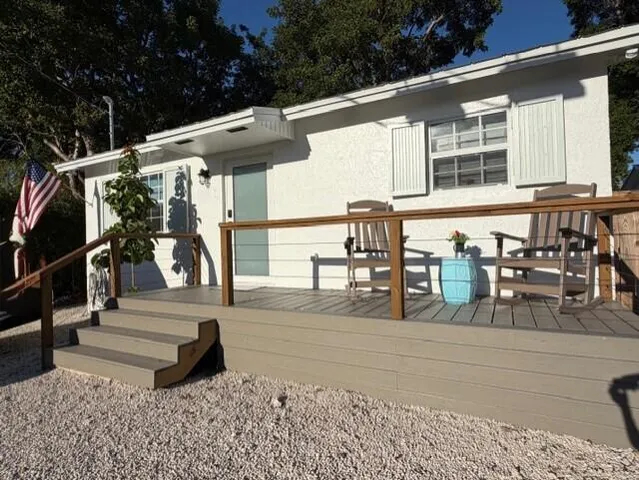 a living room with furniture window and wooden floor