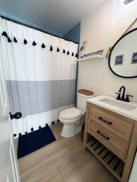 91 Treasure Boulevard Key Largo, FL 33037 - Photo 11 of 20 a bathroom with a sink a toilet and a mirror