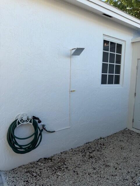 91 Treasure Boulevard Key Largo, FL 33037 - Photo 19 of 20 a bathroom with a sink and a mirror