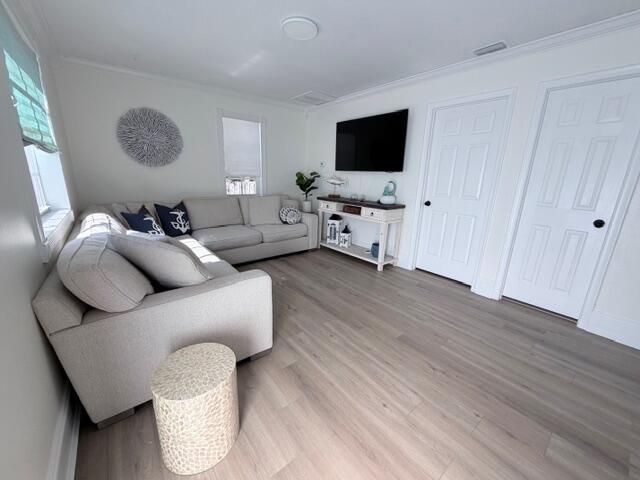 91 Treasure Boulevard Key Largo, FL 33037 - Photo 3 of 20 a living room with furniture and a flat screen tv