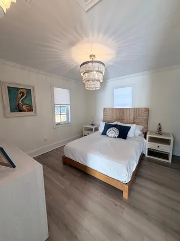 a bedroom with furniture and flat screen tv