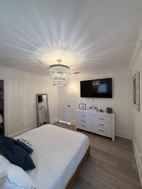 91 Treasure Boulevard Key Largo, FL 33037 - Photo 9 of 20 a bedroom with furniture and flat screen tv