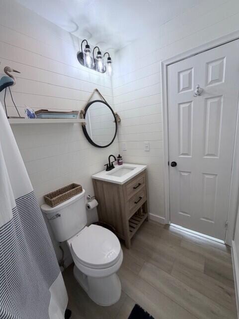 91 Treasure Boulevard Key Largo, FL 33037 - Photo 10 of 20 a bathroom with a toilet a sink and mirror