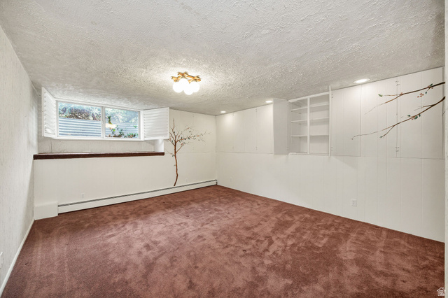 1365 Sumac Drive Logan, UT 84321 - Photo 40 of 66 Spacious room featuring brown carpeting, a window with white shutters, a decorative wall decal, built-in cabinetry, and recessed lighting