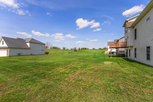 a view of a house with a big yard