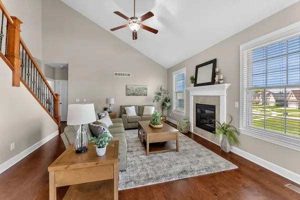 a living room with furniture and a fireplace