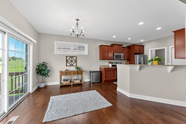 a living room with furniture and kitchen view