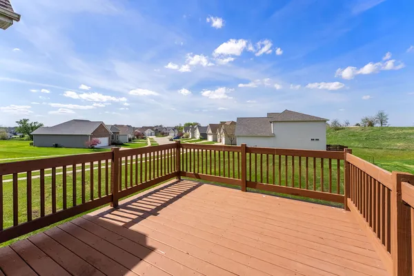 a view of a balcony with wooden floor