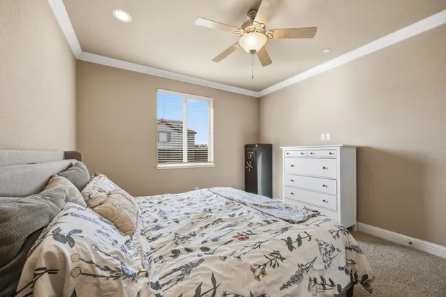a bathroom with a granite countertop tub sink and mirror