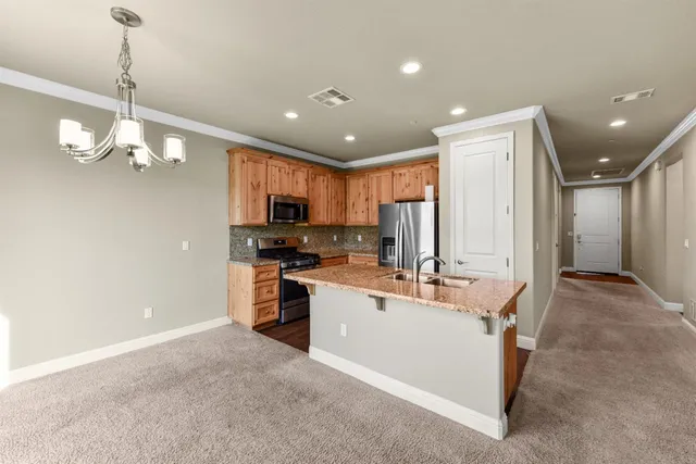 a white toilet sitting next to a white wall