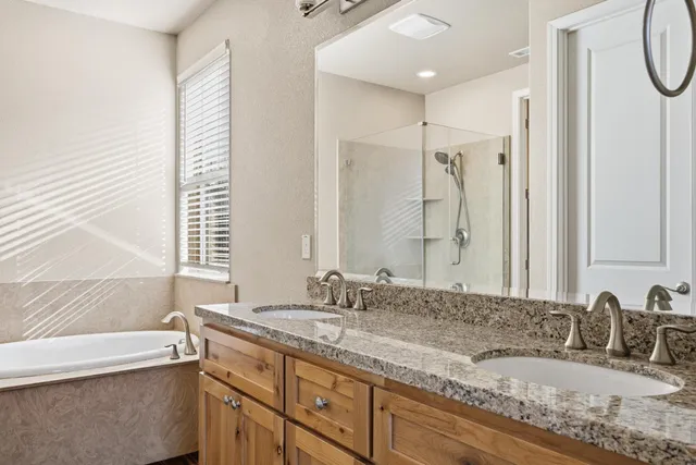 a bathroom with a bathtub and a shower