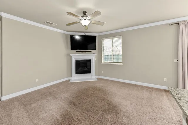 a view of a house with a yard and a deck