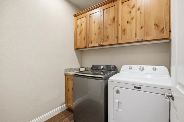 a front view of a house with yard and porch