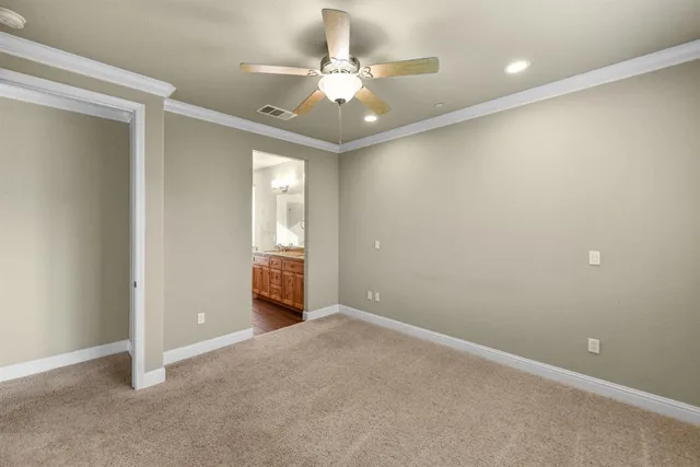 an aerial view of residential houses with outdoor space and ocean view