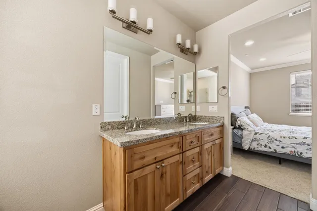 a white toilet sitting next to a white wall