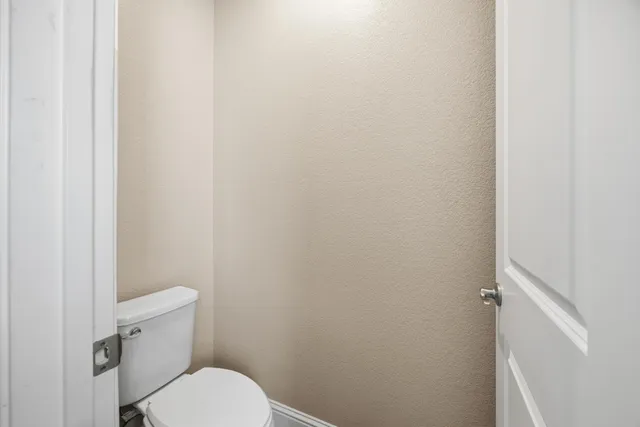 a bedroom with a bed and a mirror