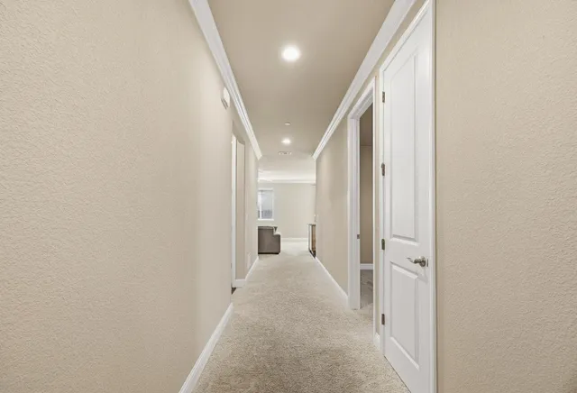 a view of a hallway with a white walls