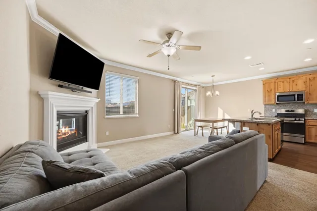 a living room with furniture fireplace and flat screen tv
