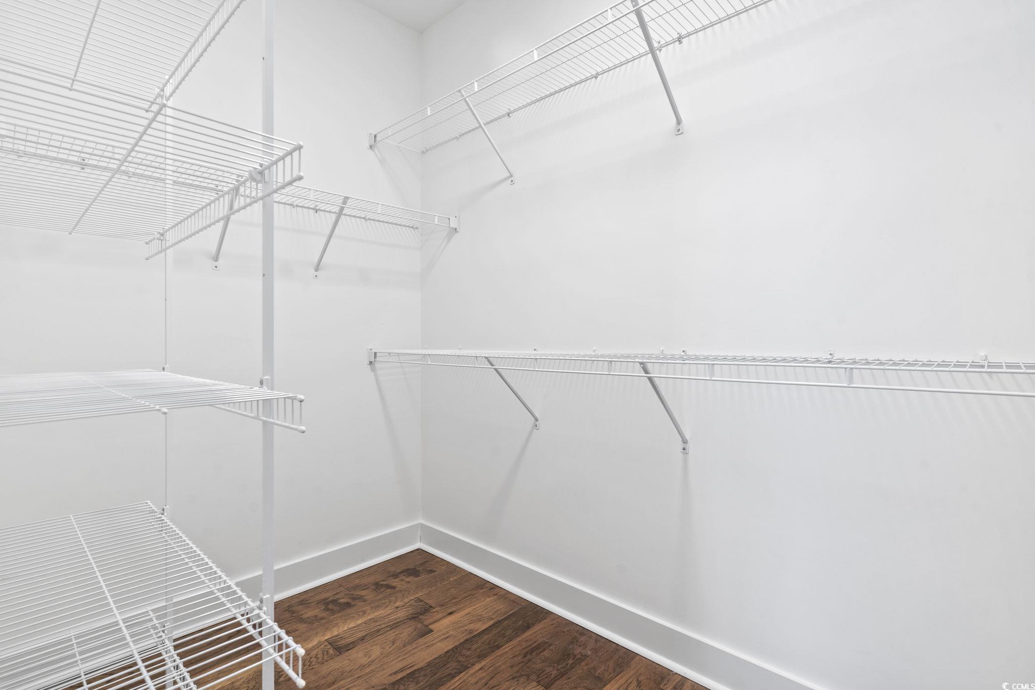 1524 Sayebrook Parkway Myrtle Beach, SC 29588 - Photo 26 of 40 Walk in closet featuring dark wood-type flooring