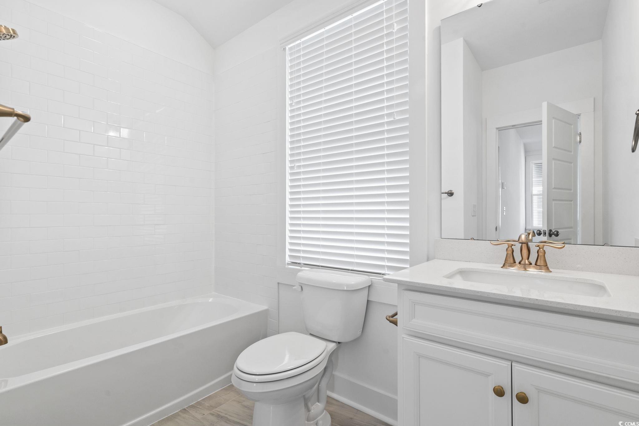 1524 Sayebrook Parkway Myrtle Beach, SC 29588 - Photo 33 of 40 Full bathroom featuring vanity and washtub / shower combination