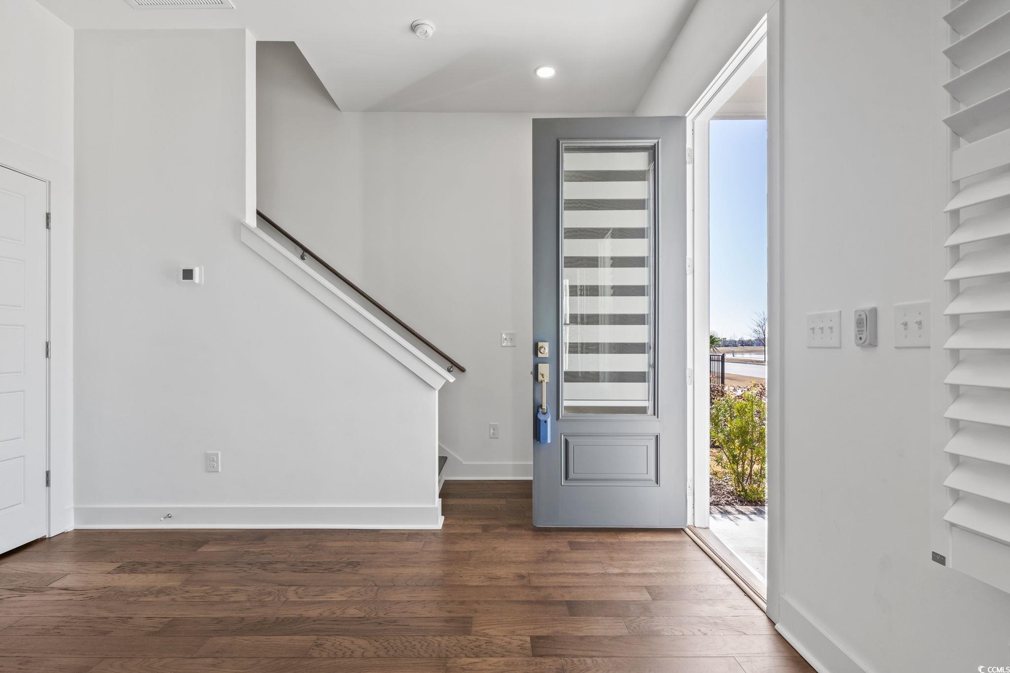 1524 Sayebrook Parkway Myrtle Beach, SC 29588 - Photo 5 of 40 Entryway featuring dark wood-type flooring, stairs, and recessed lighting