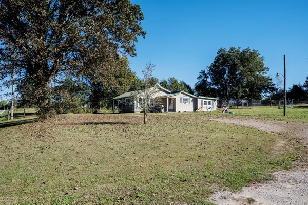 a house with trees in front of it