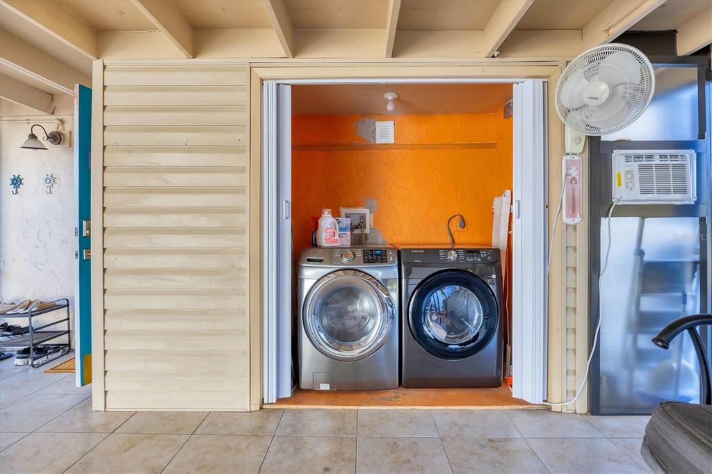 680 White Pine Tree Road, Unit 61 Venice, FL 34285 - Photo 15 of 40 a utility room with dryer and washer