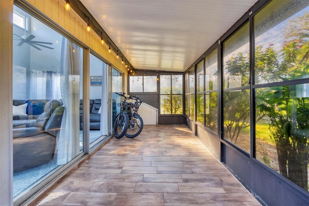 680 White Pine Tree Road, Unit 61 Venice, FL 34285 - Photo 17 of 40 a view of a hallway with a bike and next to a window