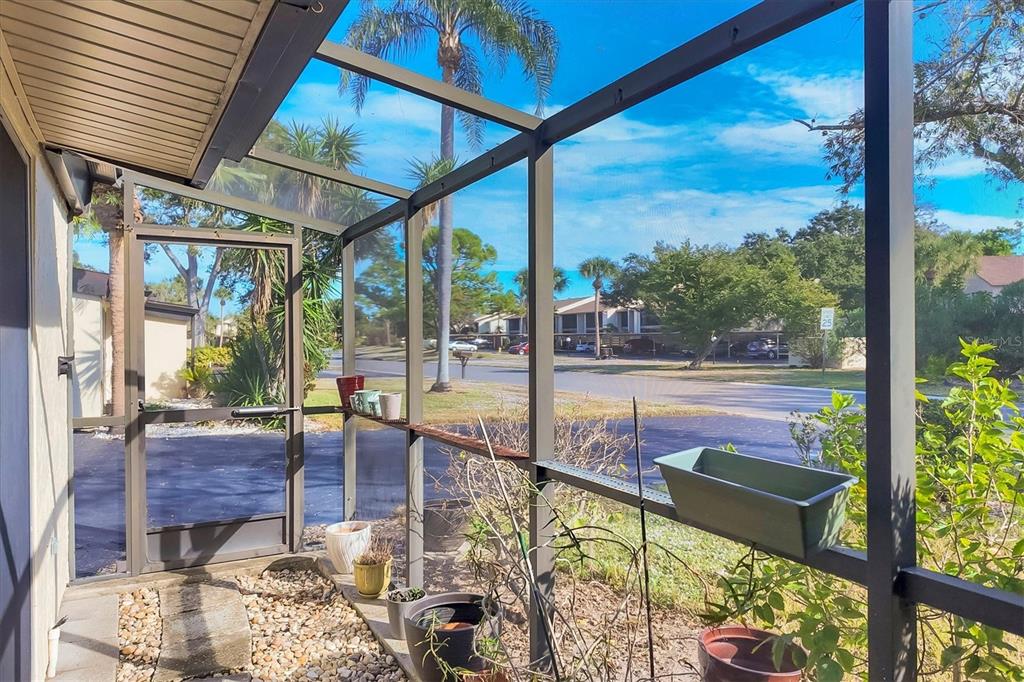 680 White Pine Tree Road, Unit 61 Venice, FL 34285 - Photo 18 of 40 a view of a floor to ceiling window with a yard