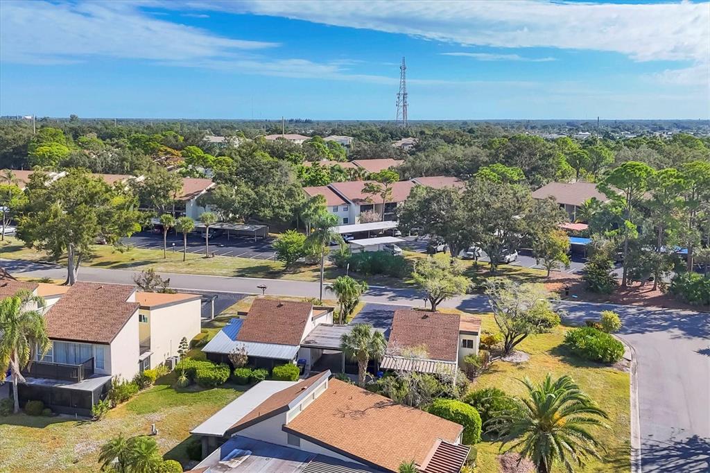 680 White Pine Tree Road, Unit 61 Venice, FL 34285 - Photo 26 of 40 a view of a city with lawn chairs