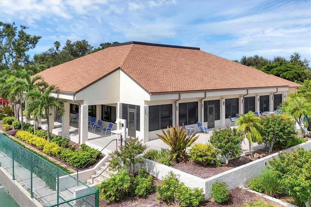 680 White Pine Tree Road, Unit 61 Venice, FL 34285 - Photo 30 of 40 a view of a house with outdoor seating area and garden