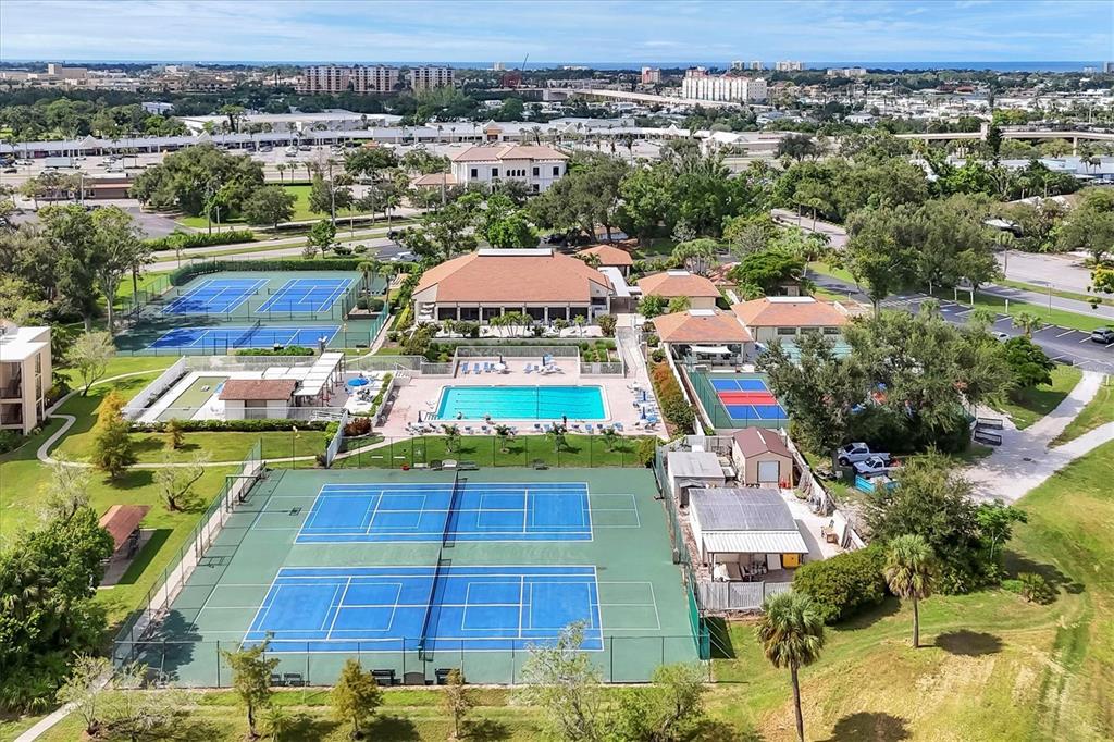 680 White Pine Tree Road, Unit 61 Venice, FL 34285 - Photo 38 of 40 an aerial view of residential houses with outdoor space and parking