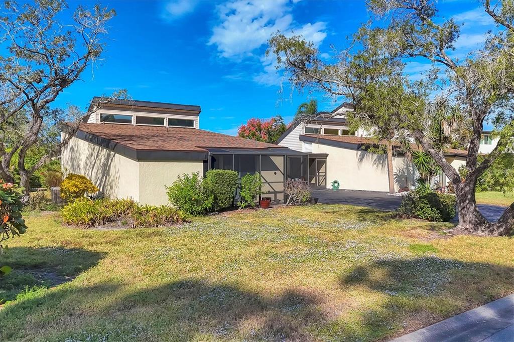 680 White Pine Tree Road, Unit 61 Venice, FL 34285 - Photo 40 of 40 a front view of house with yard