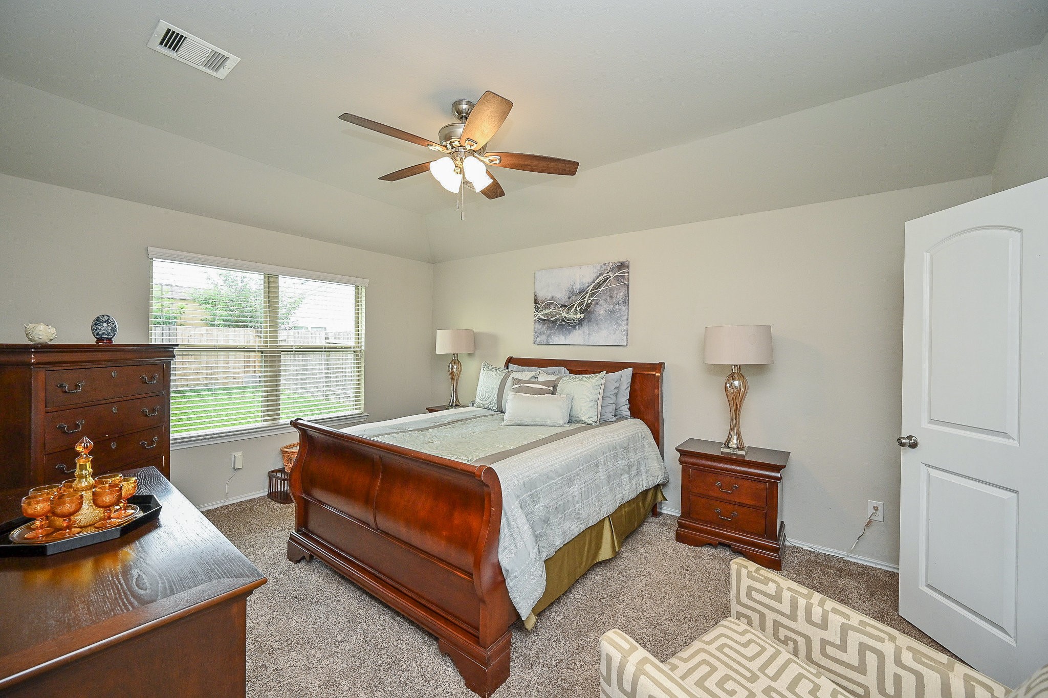 15418 Lost Lariat Court Channelview, TX 77530 - Photo 13 of 20 a bedroom with a bed and wooden floor