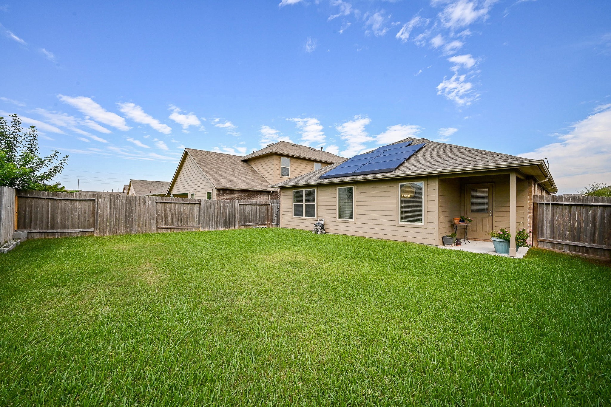 15418 Lost Lariat Court Channelview, TX 77530 - Photo 19 of 20 a view of a house with backyard and garden