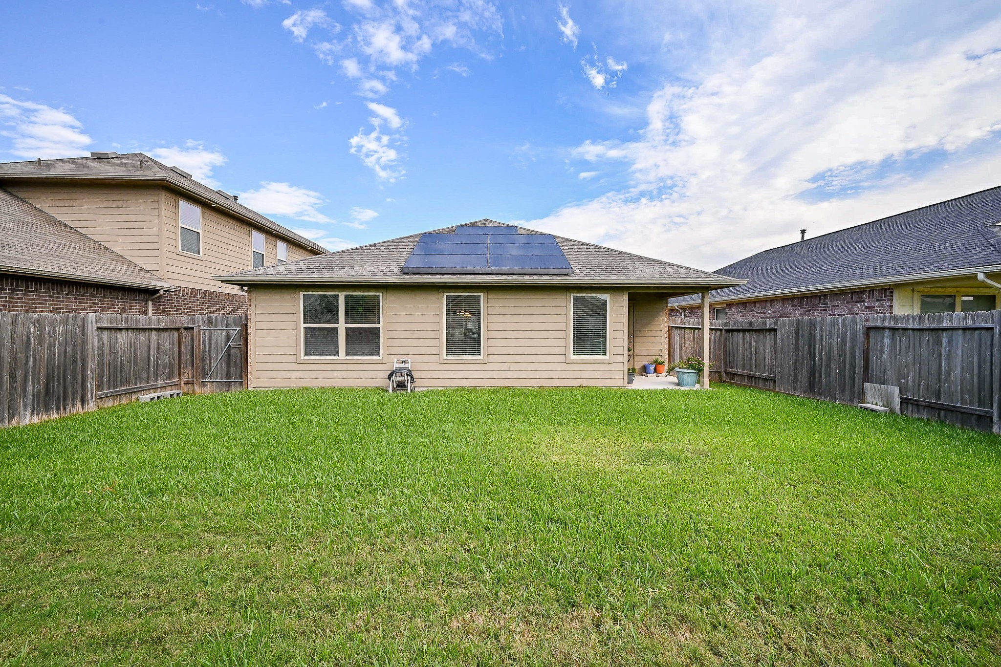 15418 Lost Lariat Court Channelview, TX 77530 - Photo 20 of 20 a view of a house with backyard and garden