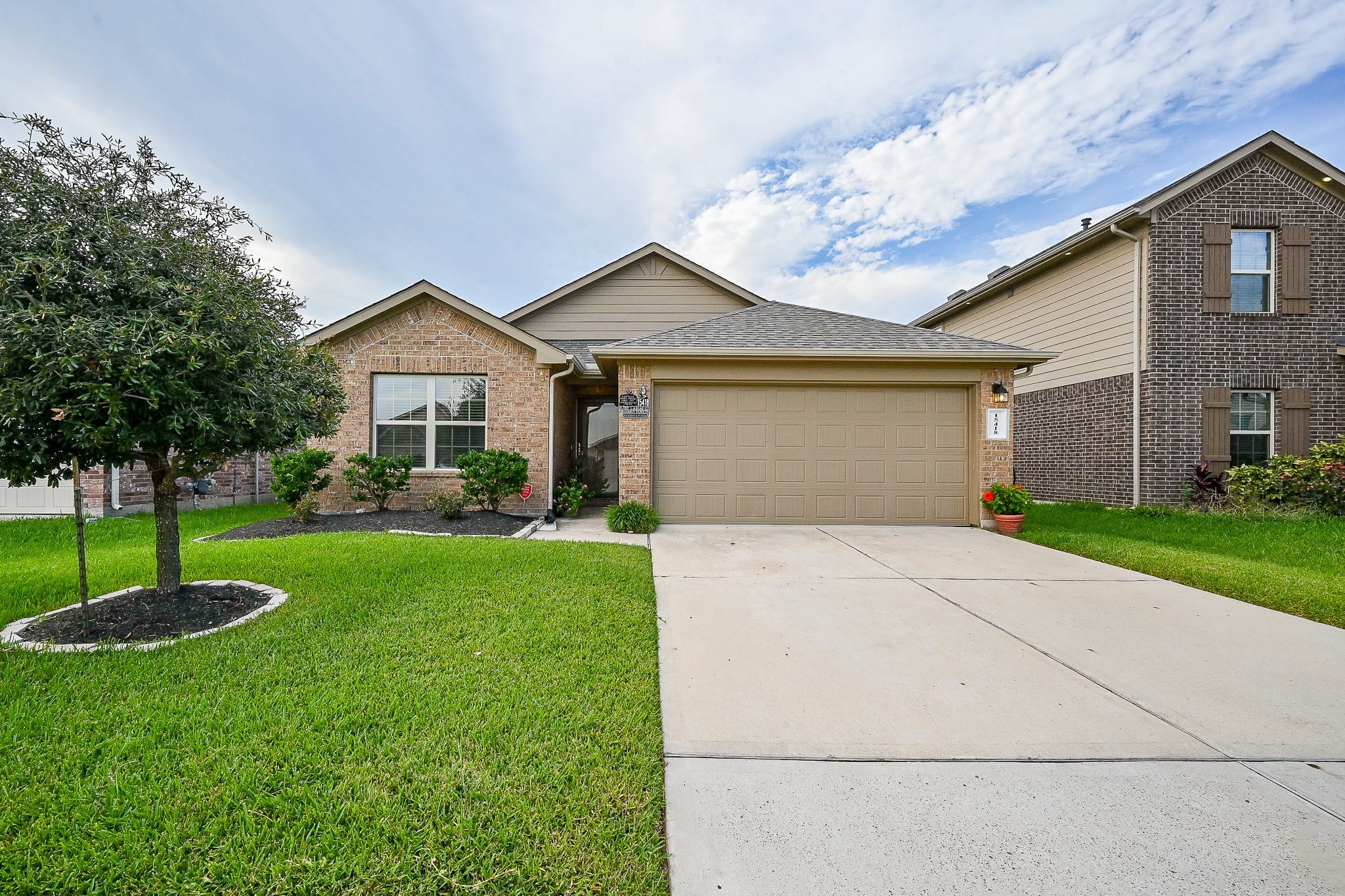 15418 Lost Lariat Court Channelview, TX 77530 - Photo 2 of 20 a view of a house with a swimming pool and a yard