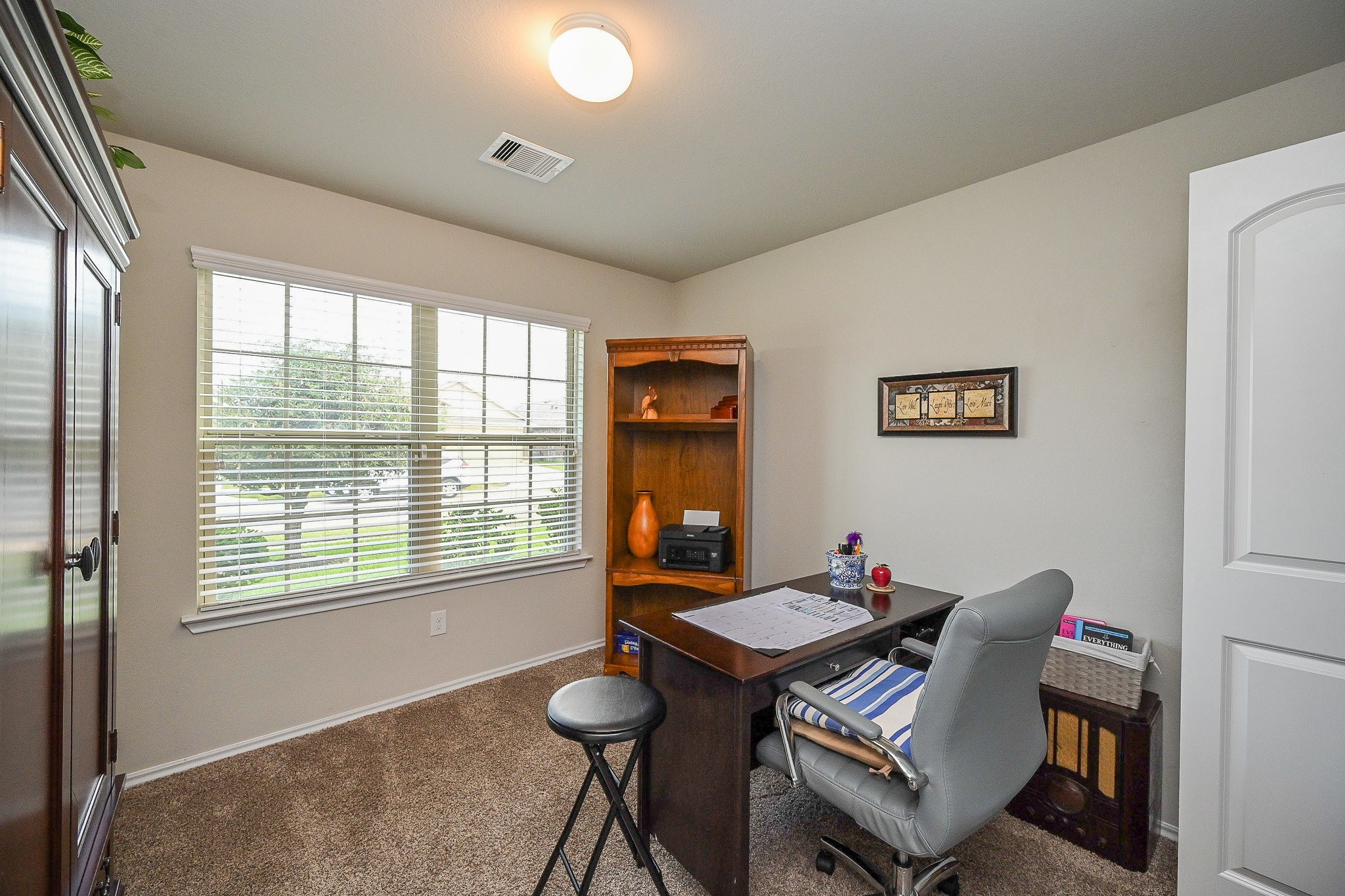 15418 Lost Lariat Court Channelview, TX 77530 - Photo 5 of 20 a workspace with furniture window and outside view