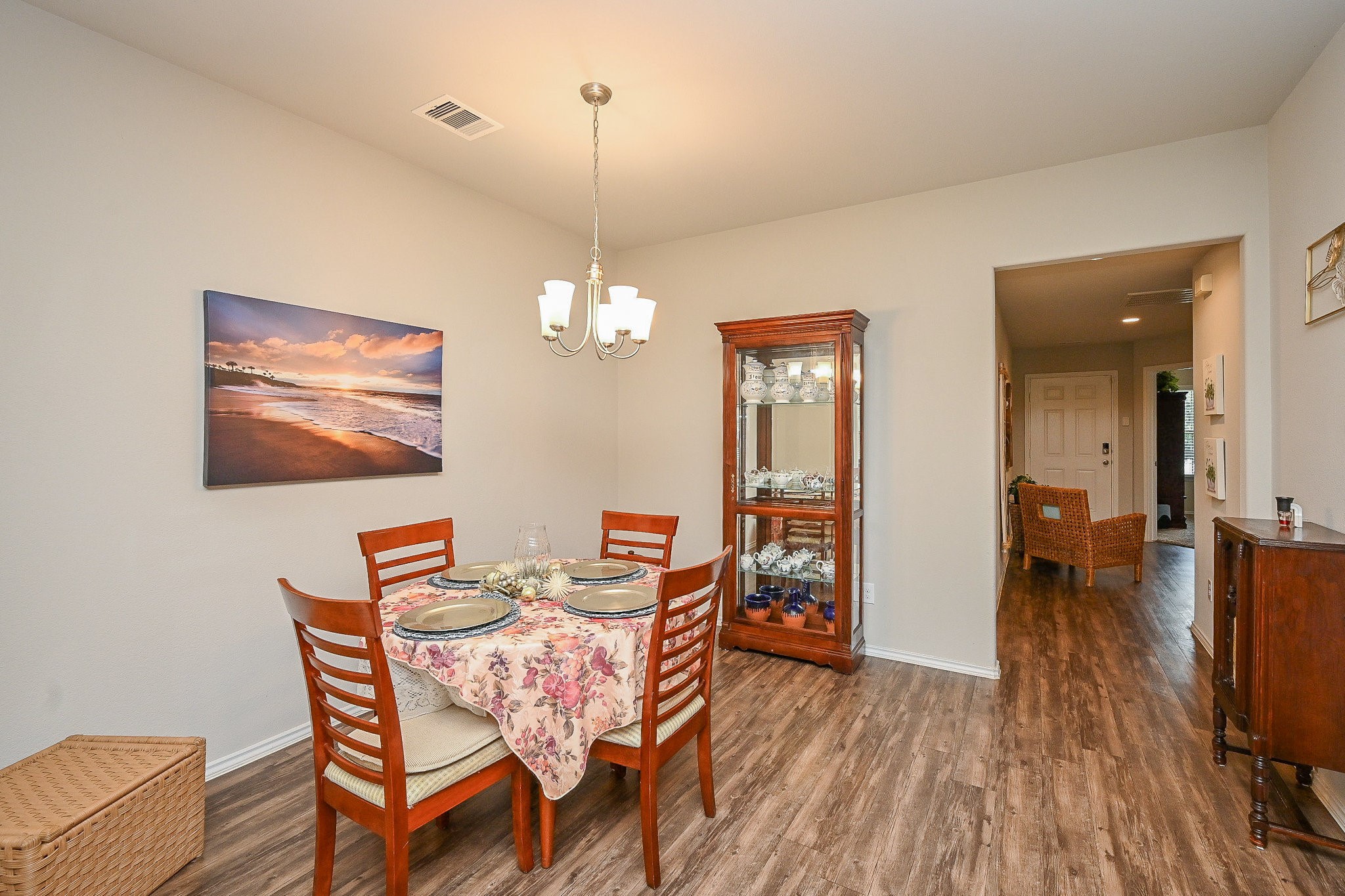 15418 Lost Lariat Court Channelview, TX 77530 - Photo 10 of 20 a dining room with furniture a chandelier and wooden floor