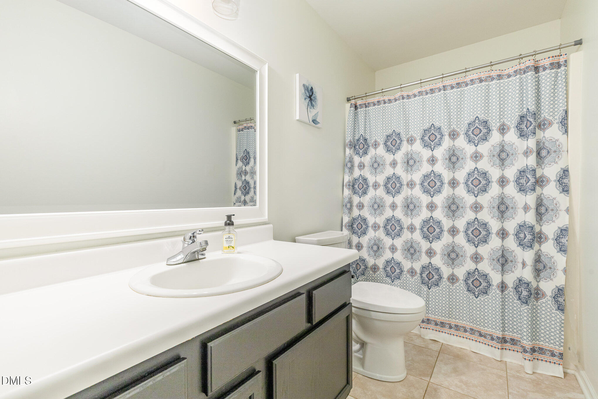 2813 Glastonbury Road Apex, NC 27539 - Photo 16 of 21 a bathroom with a sink toilet and shower
