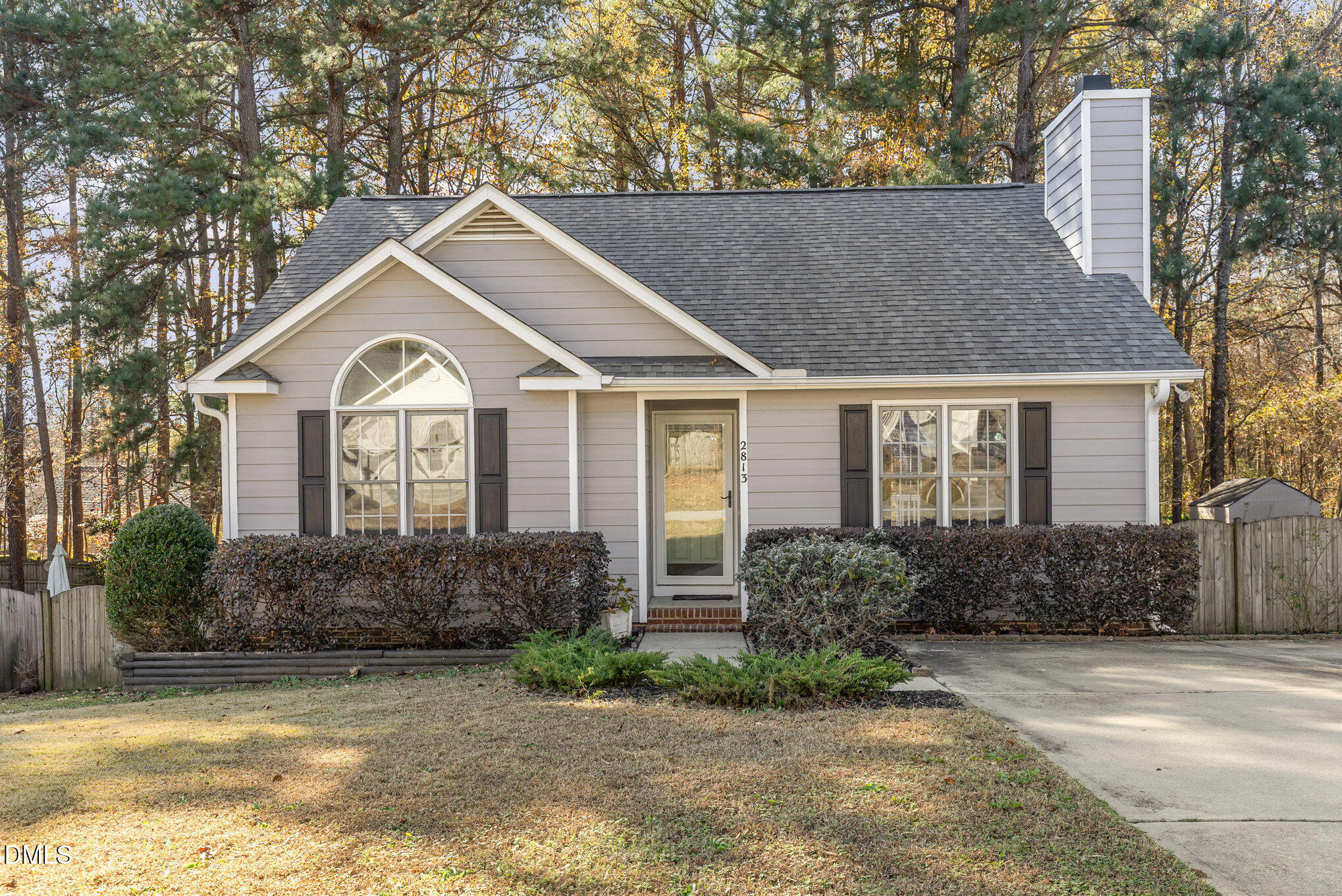 2813 Glastonbury Road Apex, NC 27539 - Photo 3 of 21 a front view of a house with garden