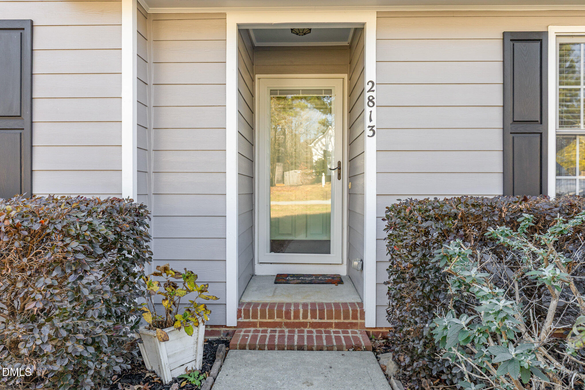 2813 Glastonbury Road Apex, NC 27539 - Photo 4 of 21 a view of entrance door of the house