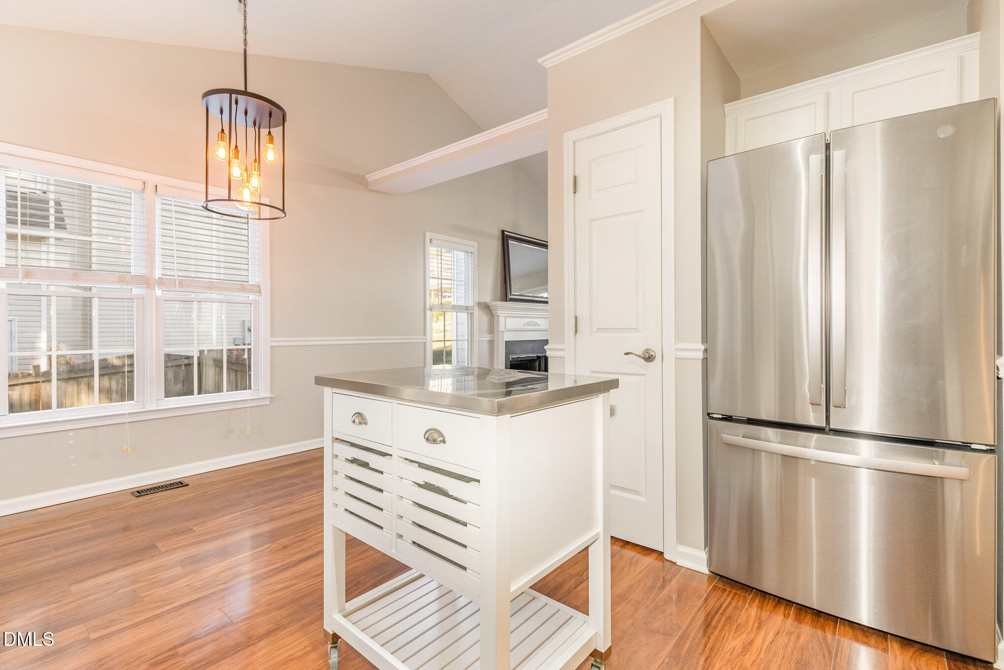2813 Glastonbury Road Apex, NC 27539 - Photo 9 of 21 a kitchen with stainless steel appliances granite countertop a refrigerator a stove and a wooden floors