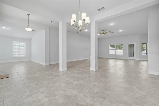 a view of a kitchen with a stove and a sink cabinets