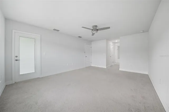 a spacious bathroom with a granite countertop sink a toilet a bathtub and shower