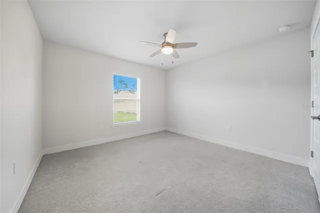 a house with green field in front of it
