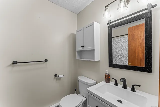 a balcony with wooden floor and trees