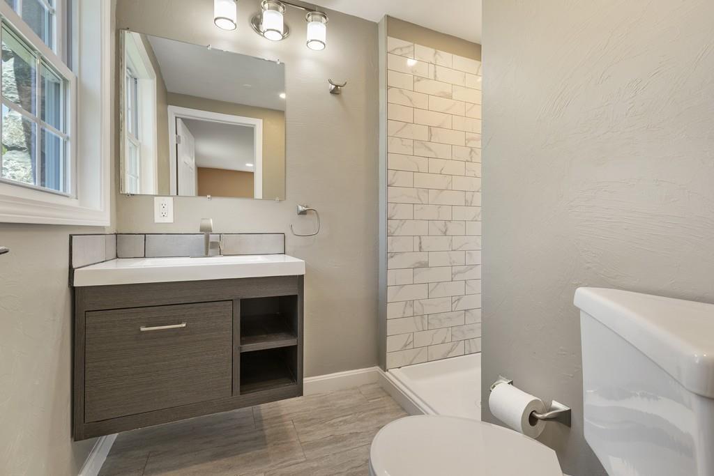 333 Berlin Road Marlborough, MA 01752 - Photo 17 of 32 a bathroom with a sink a toilet and shower